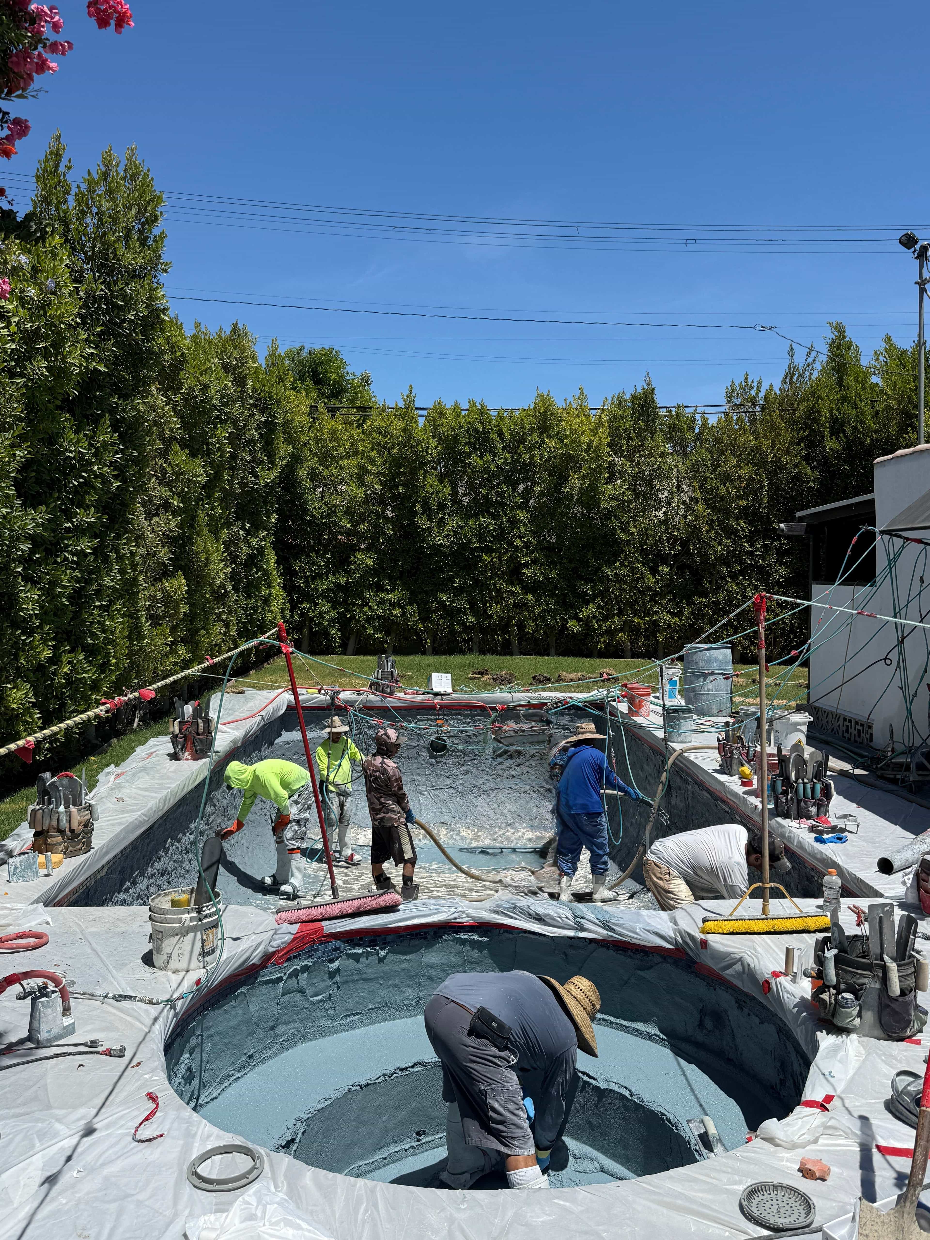 Team working on pool installation